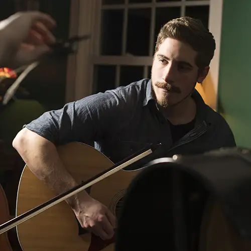 Zach Bauman playing the Guitar